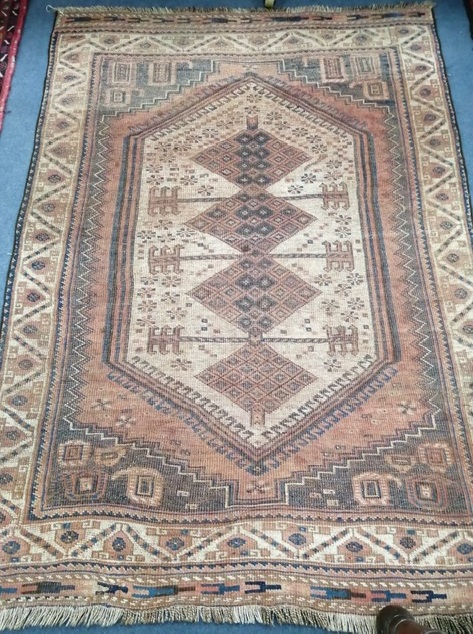 A Turkish red ground rug 120 x 170cm